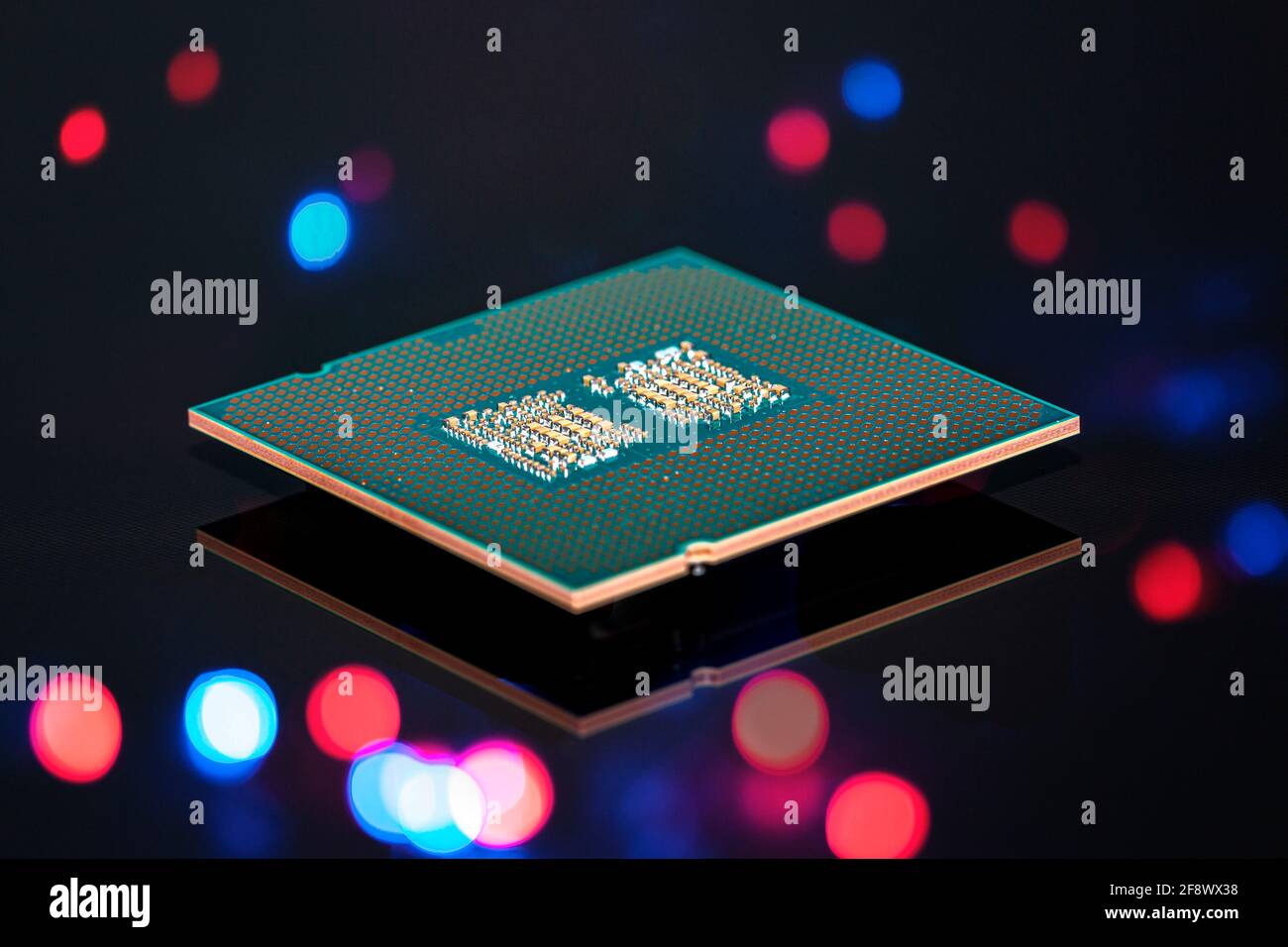 A current computer processor is reflected on a black background Stock Photo