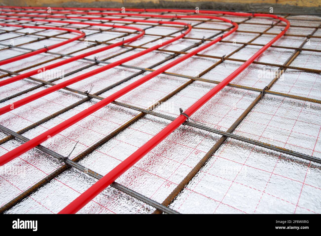 Underfloor plumbing pipes water heating installation before pouring the