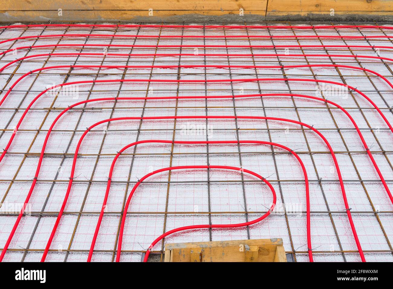 Underfloor plumbing pipes water heating installation before pouring the screed. Stock Photo