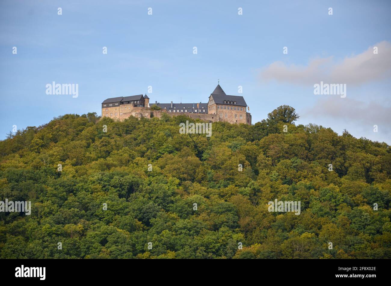 View of the fortress Waldeck on a mountain at the Edersee with blue sky in the background Stock Photo