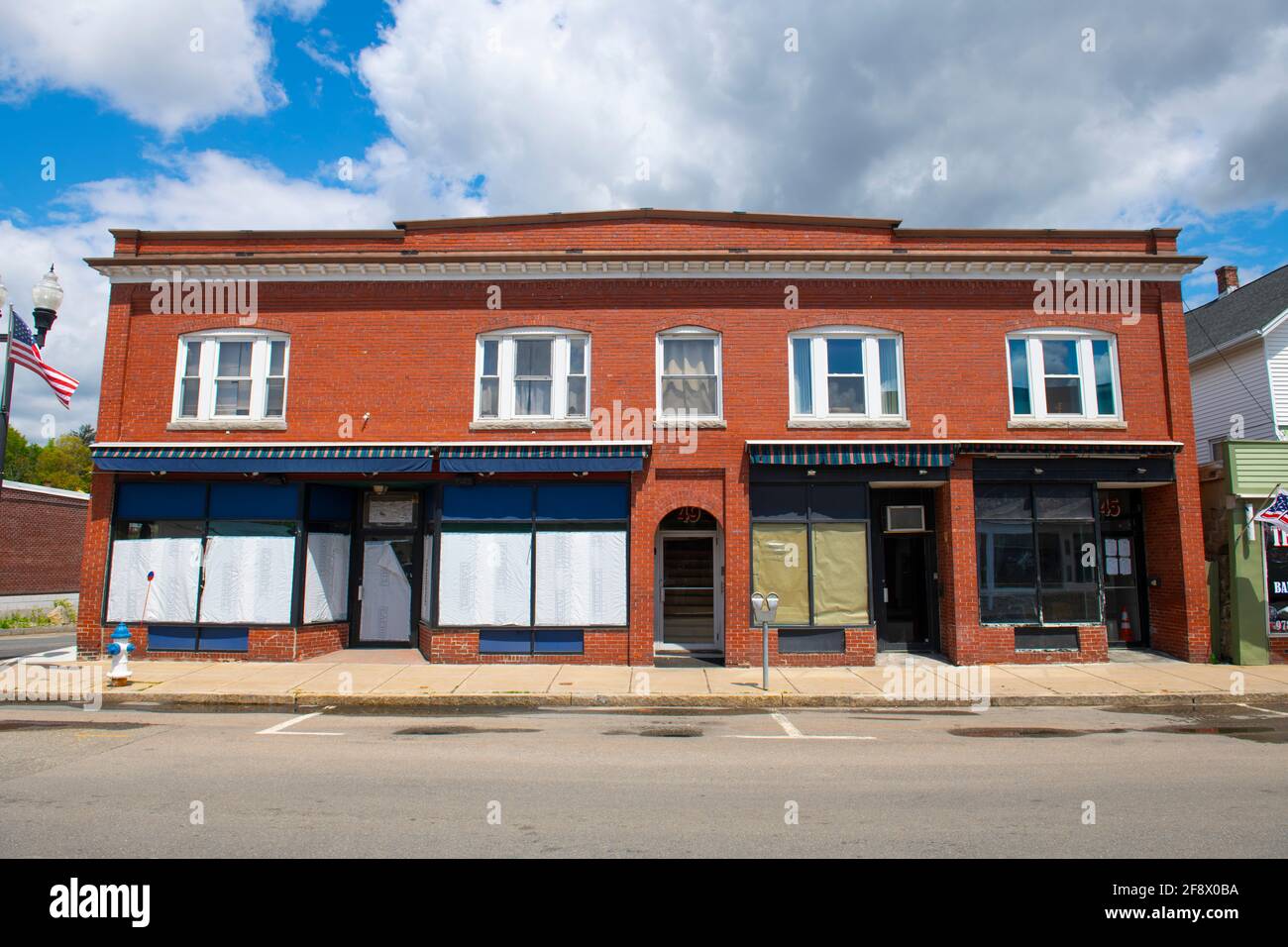 Historic commercial buildings on Main Street in Maynard historic town center in summer, Maynard