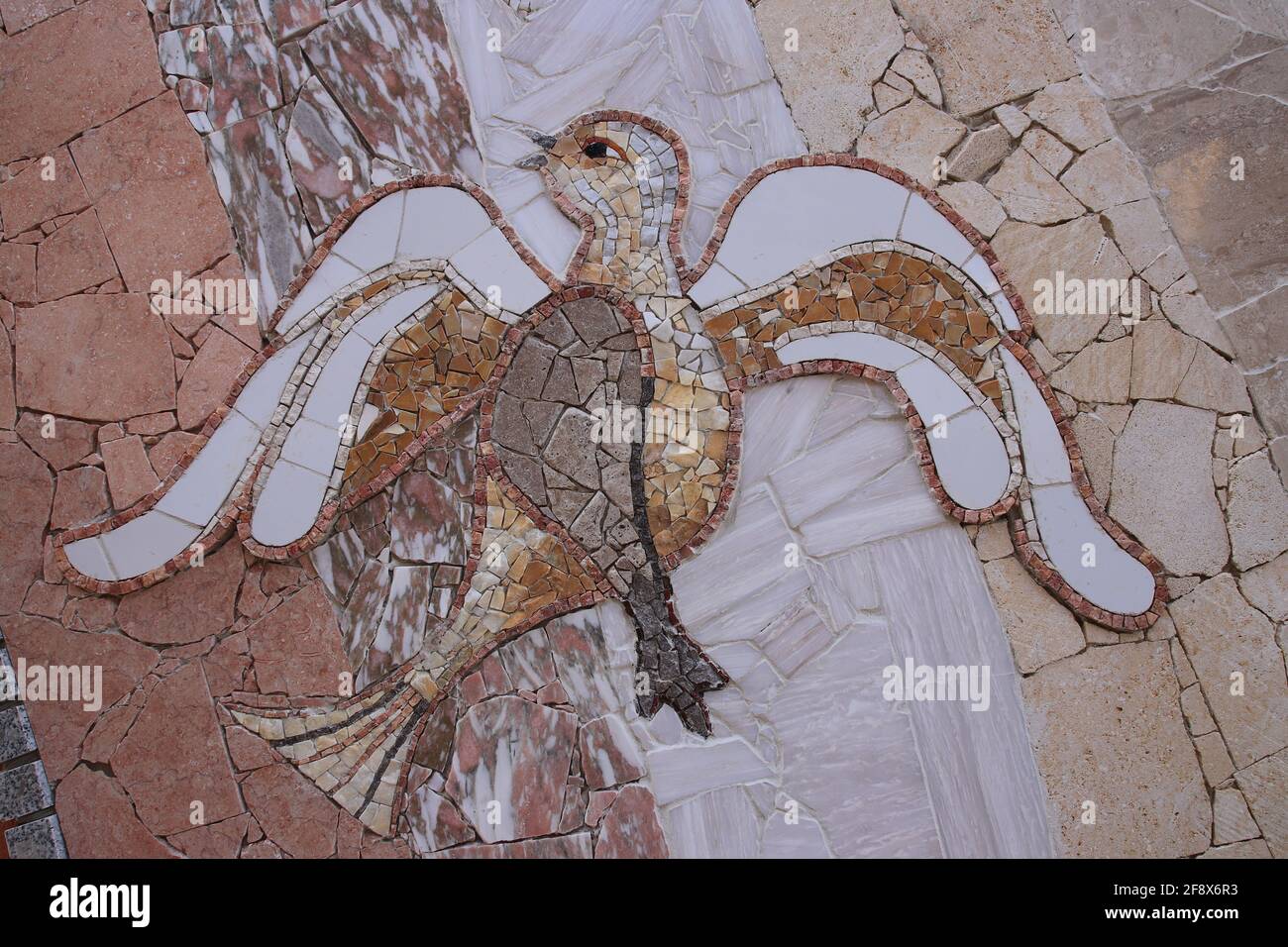 Creative colorful design mozaic art in the shape of bird. Stock Photo