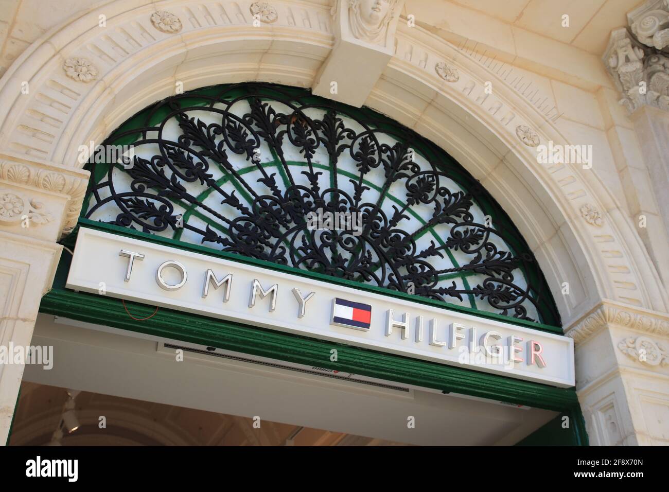 Valetta, Malta - October 22, 2020: Tommy Hilfiger sign. Tommy Hilfiger  Corporation is a manufacturer of clothing. It produces and sells sporting  men's Stock Photo - Alamy