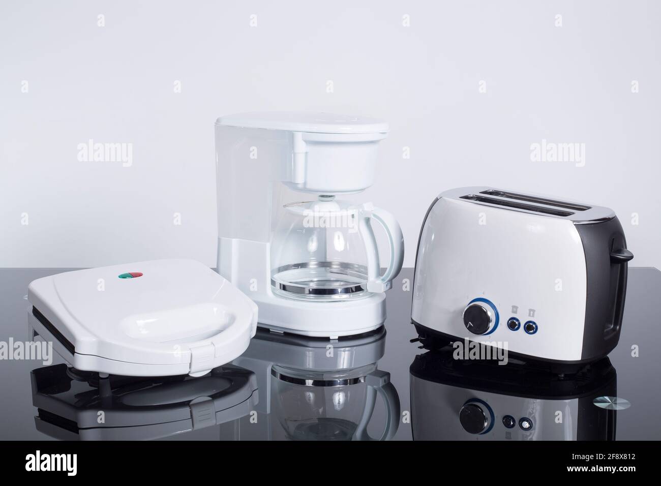 Kitchen appliances. Blender, toaster, coffee machine, meat ginder, microwave  oven and kettle. 3d Stock Photo - Alamy