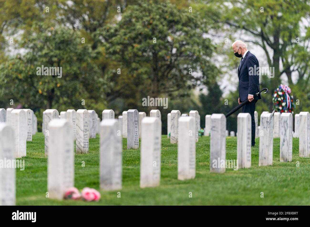 Arlington, United States Of America. 15th Apr, 2021. U.S President Joe Biden walks past graves in Section 60 at Arlington National Cemetery as he pays respect to service members who died in the Afghan and Iraq wars April 14, 2021 in Arlington, Virginia. Earlier Biden announced that he will be withdrawing all forces from Afghanistan by September 11th. Credit: Planetpix/Alamy Live News Stock Photo