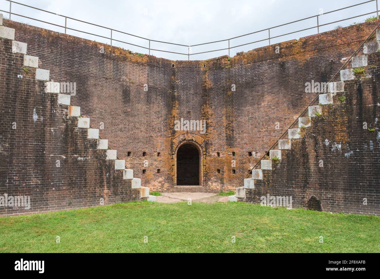 GULF SHORES, AL, USA - MARCH 28, 2021: Interior corner of Fort Morgan with arched doorway and stairs Stock Photo