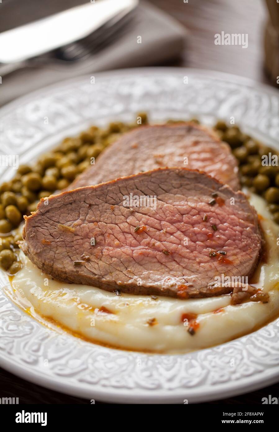 Roast Beef With Mashed Potatoes and Peas Stock Photo