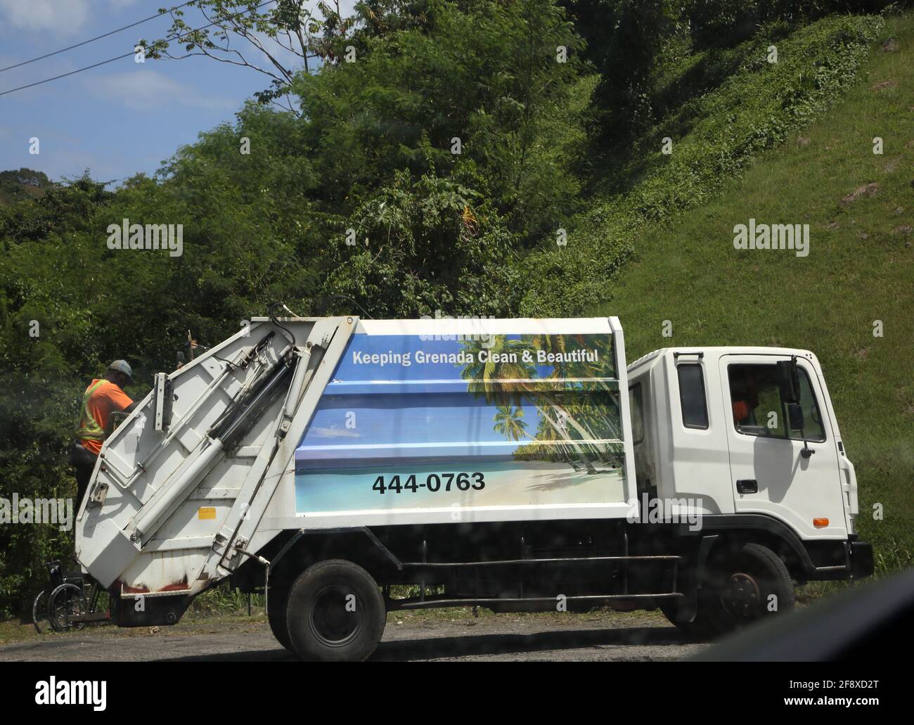 Grenada near Concord St John coast road Dustbin lorry keeping Grenada Clean Stock Photo