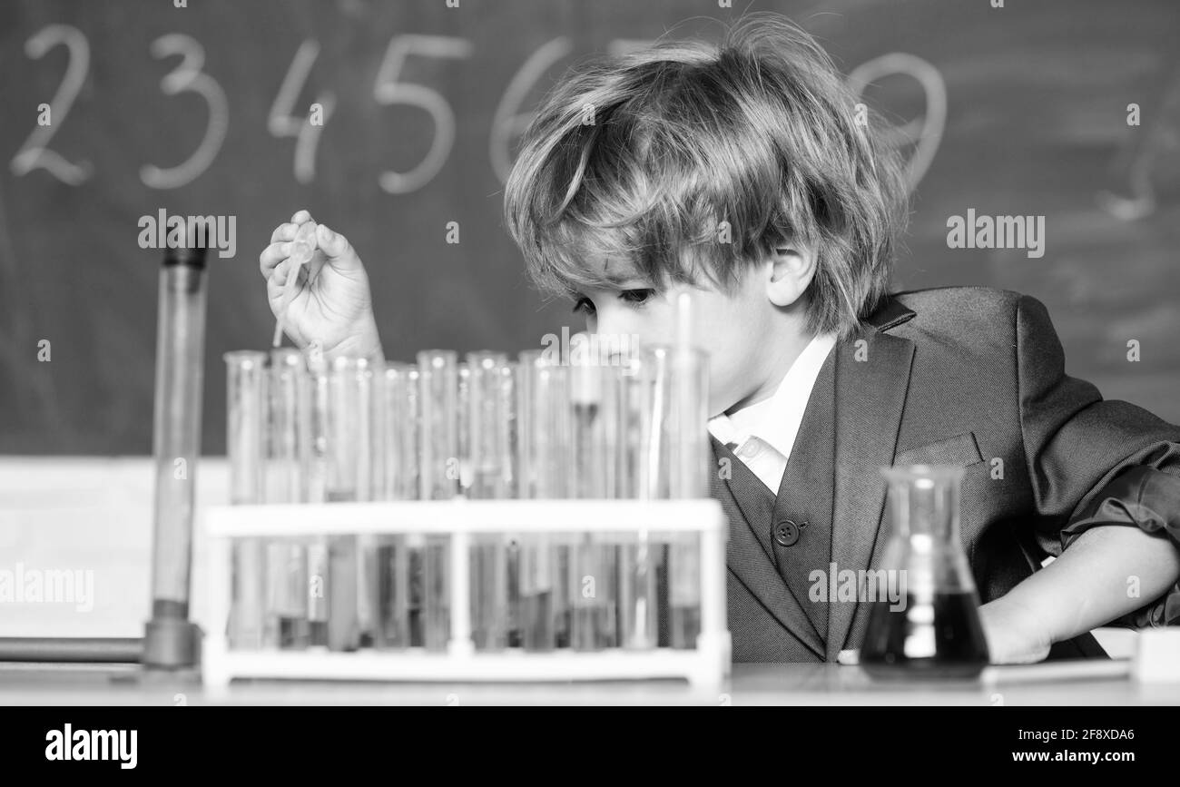 science experiments in lab. Little boy is making science experiments
