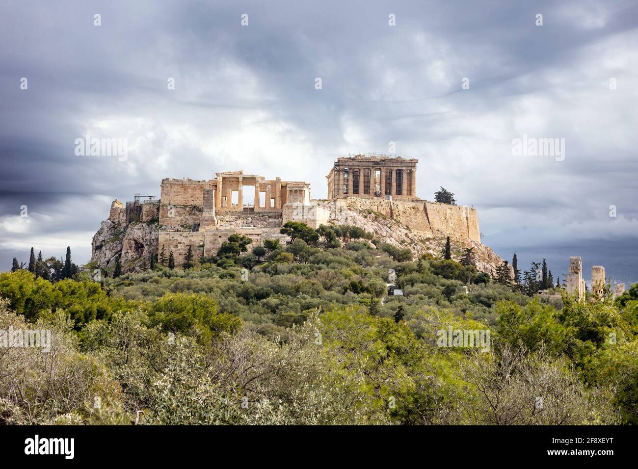 Athens, Greece. Acropolis and Parthenon temple, top landmark. Scenic view of ancient Greece remains from Philopappos Hill, cloudy sky background. Stock Photo