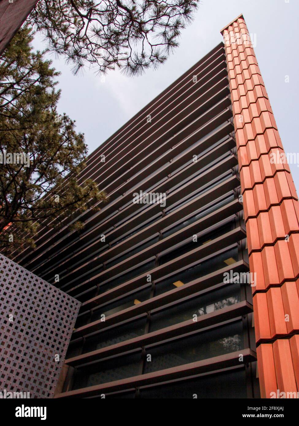 Sharp corner, exterior terra cotta orange brick tiled, Mario Botta designed Leeum Museum of Art. In Seoul, South Korea. Stock Photo