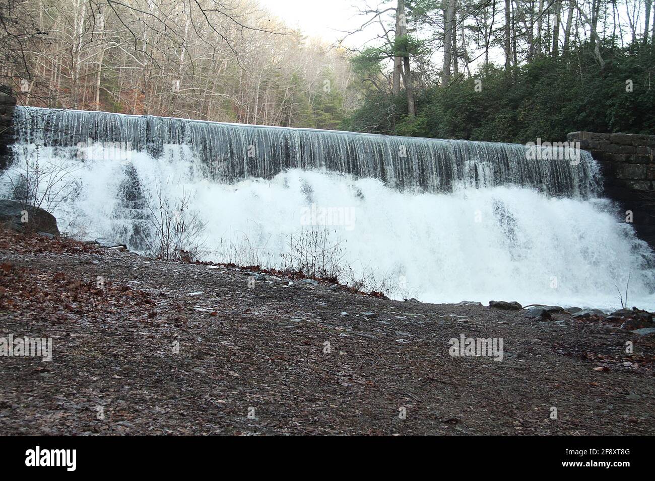 Otter Lake Dam, Virginia, USA. Waterfall along mountain creek in a