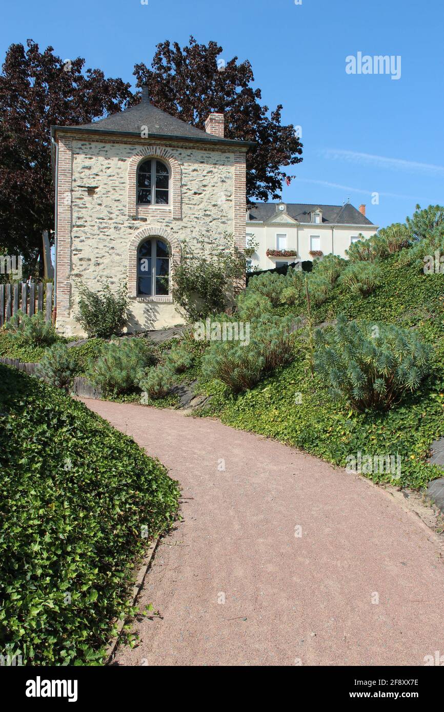 stone house in a garden in chemilléenanjou (france Stock Photo Alamy