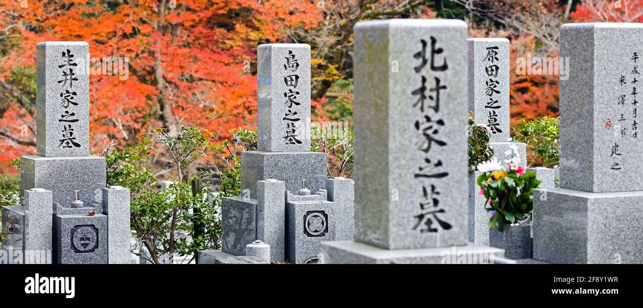 Cemetery headstones in autumn, Minoh Falls Pathway, Minoh Park, Osaka, Japan Stock Photo