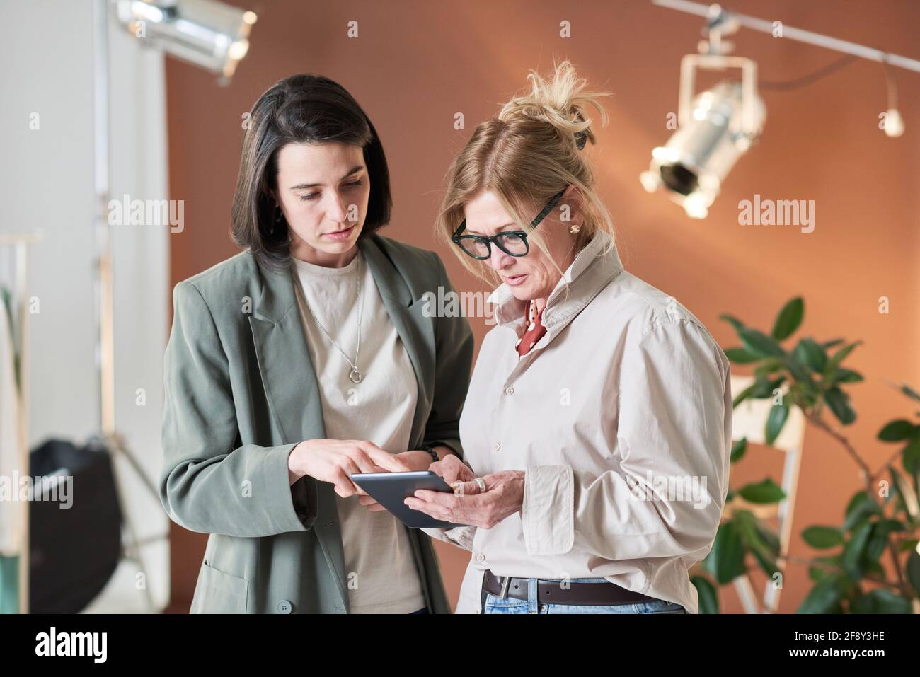 Two business colleagues using digital tablet and working in team at office Stock Photo