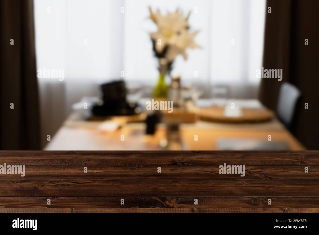 Modern luxury kitchen dining table black golden tone with wooden tabletop space for display or montage your products. Stock Photo