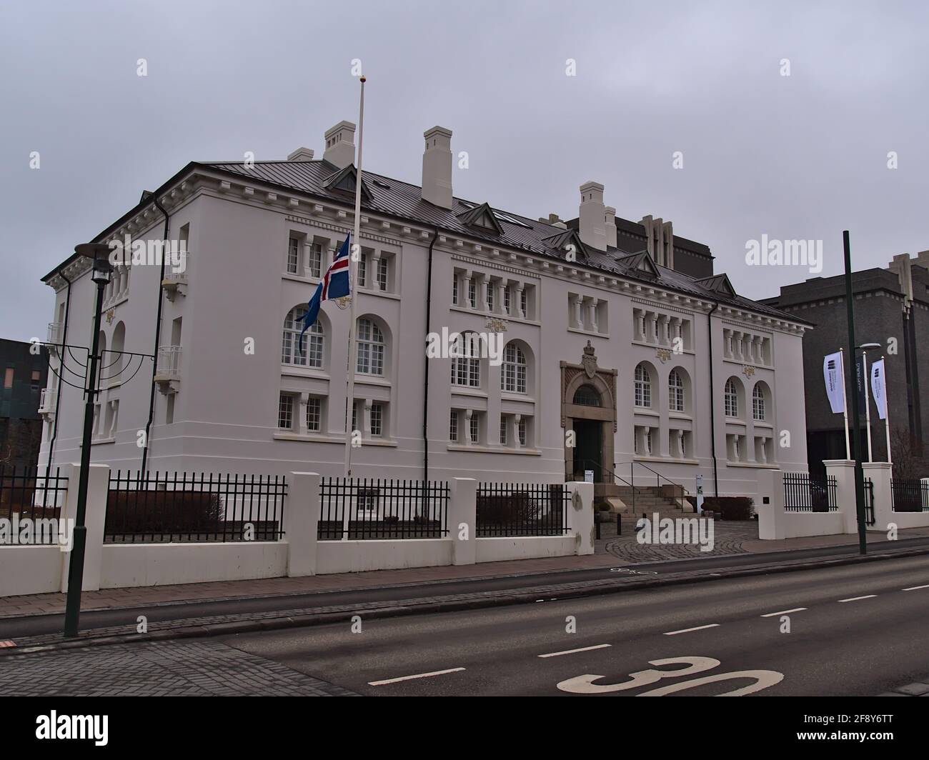 View of old building Safnahúsið (Icelandic: 'the culture house'), an exhibition space in Reykjavik city center, on cloudy winter day with empty street. Stock Photo