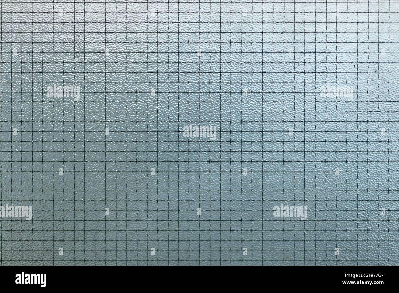 Wire mesh glass or protective safety laminated tempered glass texture pattern for background Stock Photo