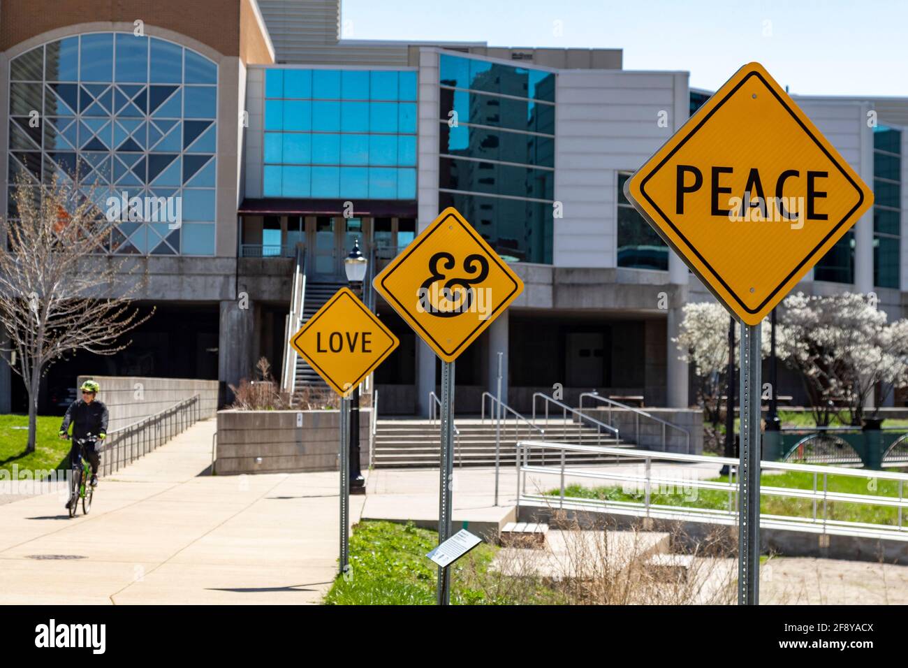 Lansing, Michigan - Signs promote peace and love to riders and walkers along a path by the Grand River. Stock Photo