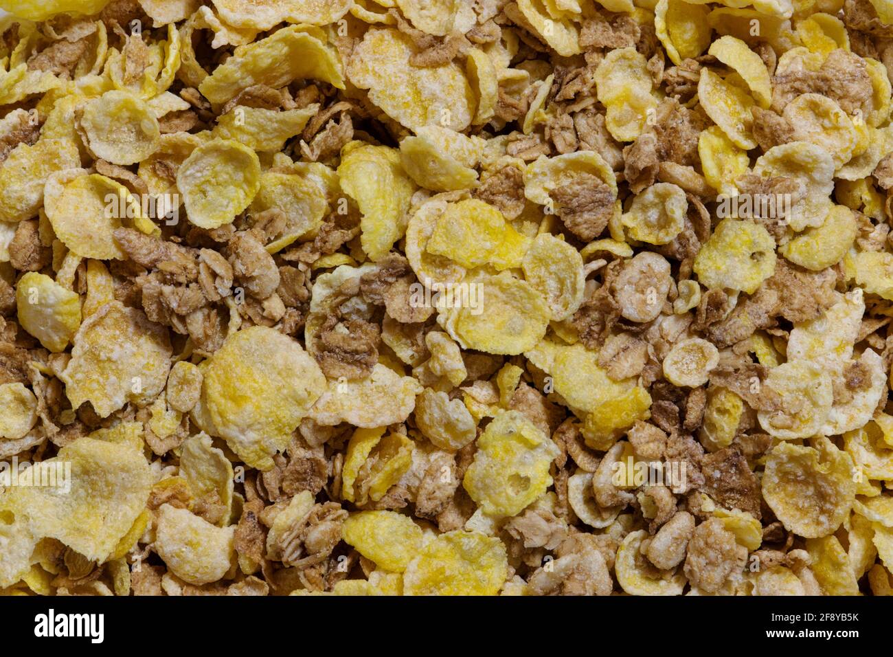 Dry breakfast cereal whole grains, granola and oat flakes concept background image. Stock Photo
