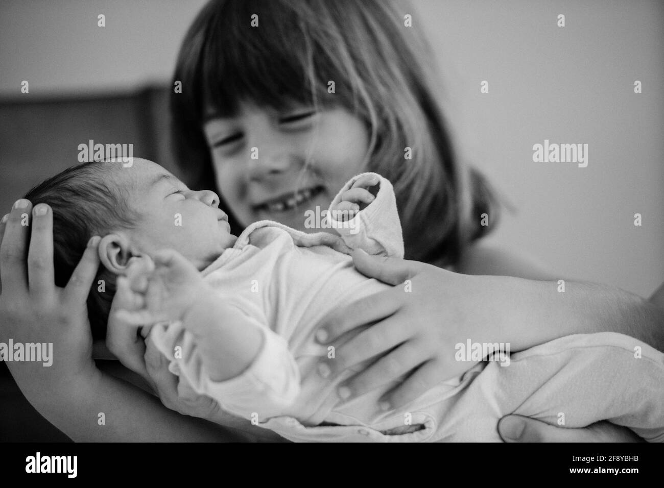 Portrait of sister with newborn baby Stock Photo