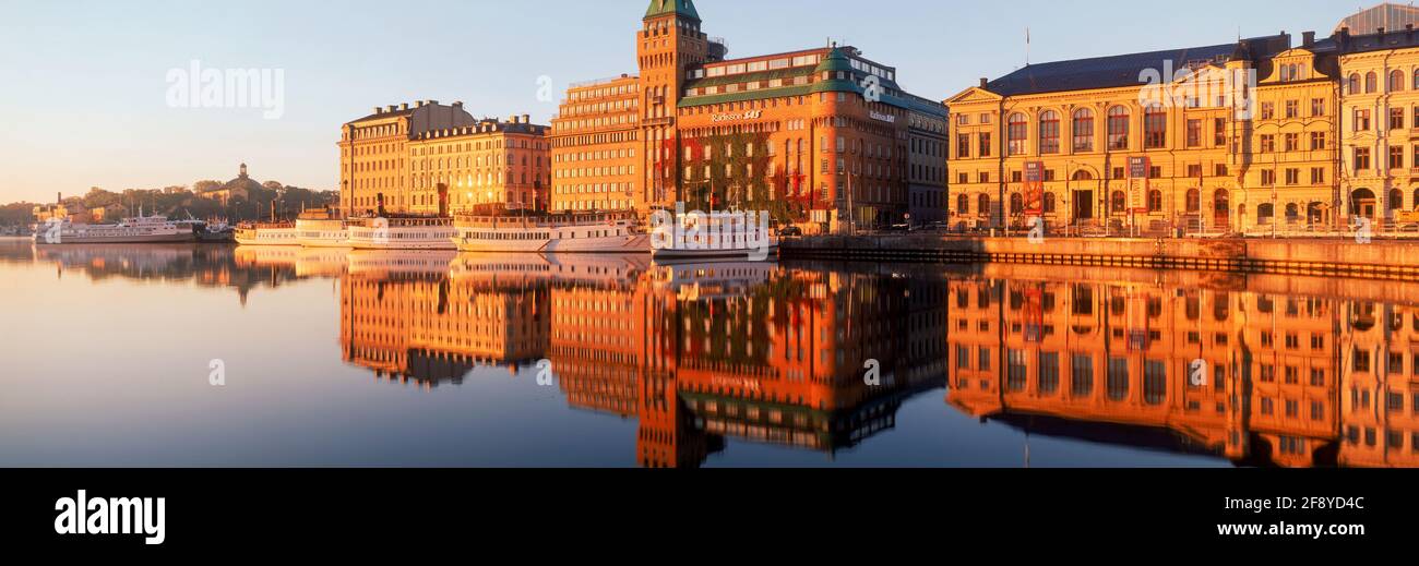 Buildings reflecting in water, Stockholm, Sweden Stock Photo