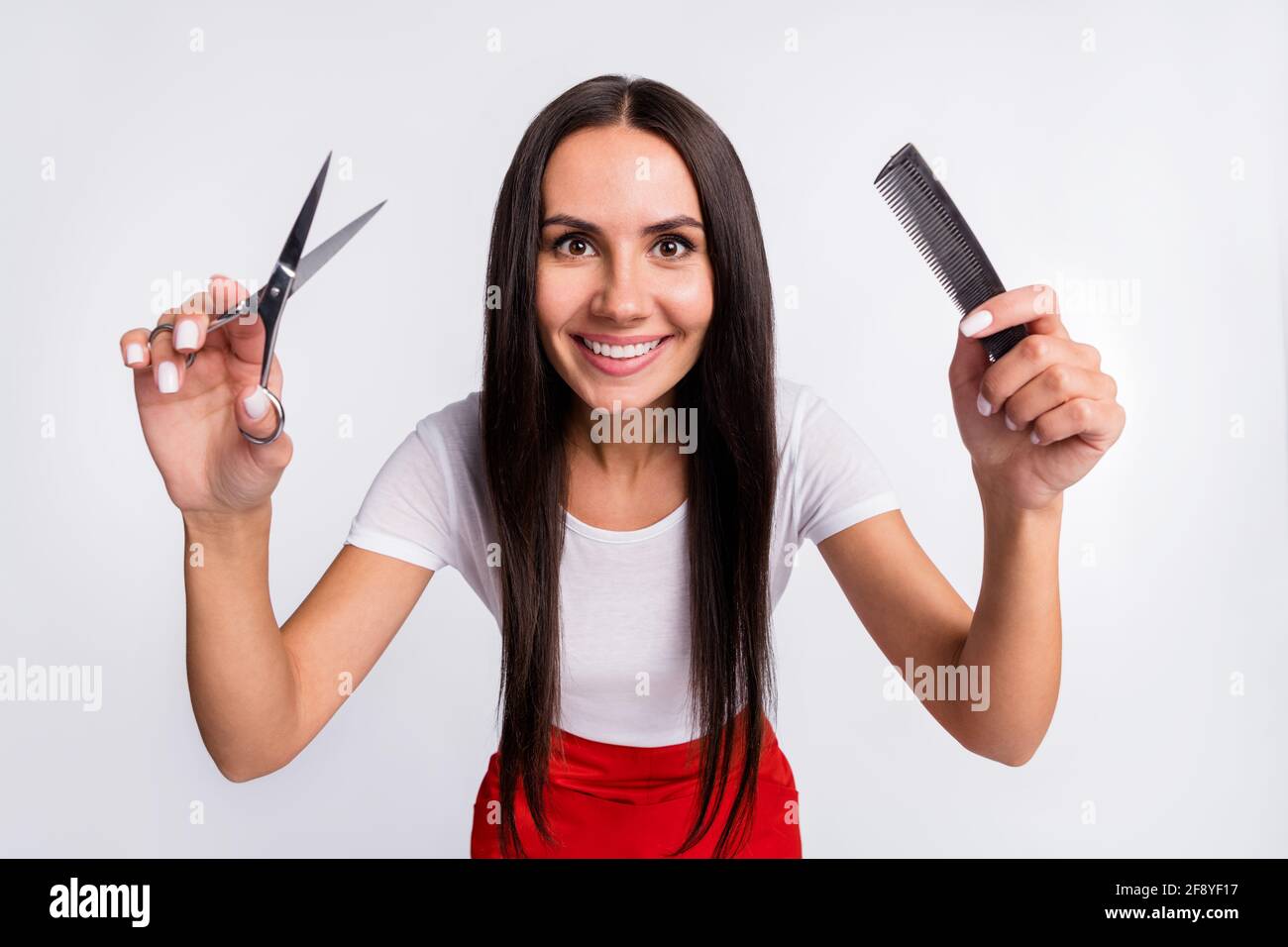 Photo of nice optimistic brunette lady with brush scissors wear white t ...