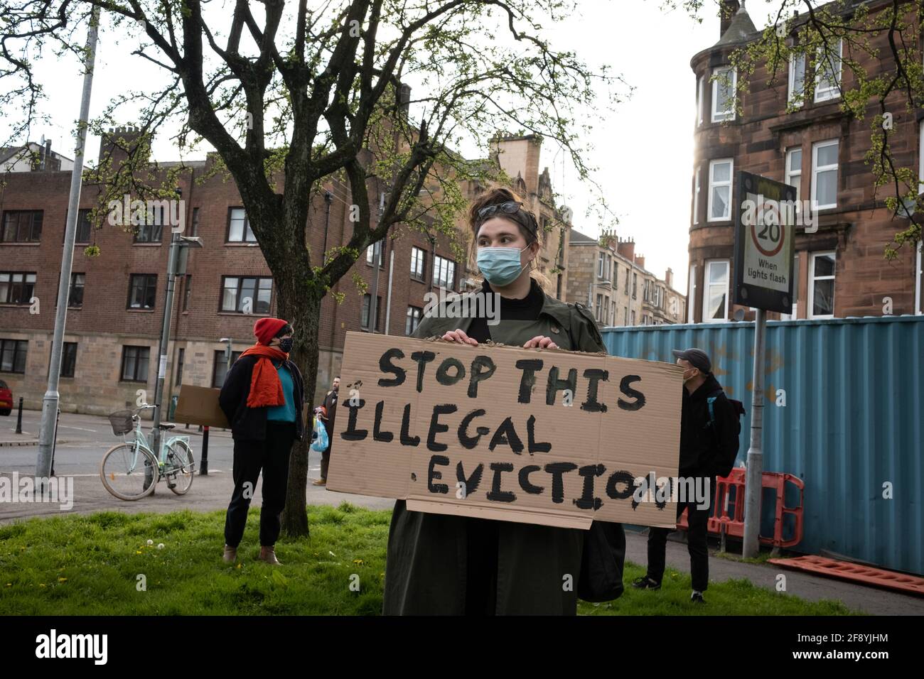 Glasgow, UK, 15th April 2021. Demonstration by Living Rent Glasgow as a  show of strength and supporter for a local resident (a mother with  children) in Govanhill district who is facing an