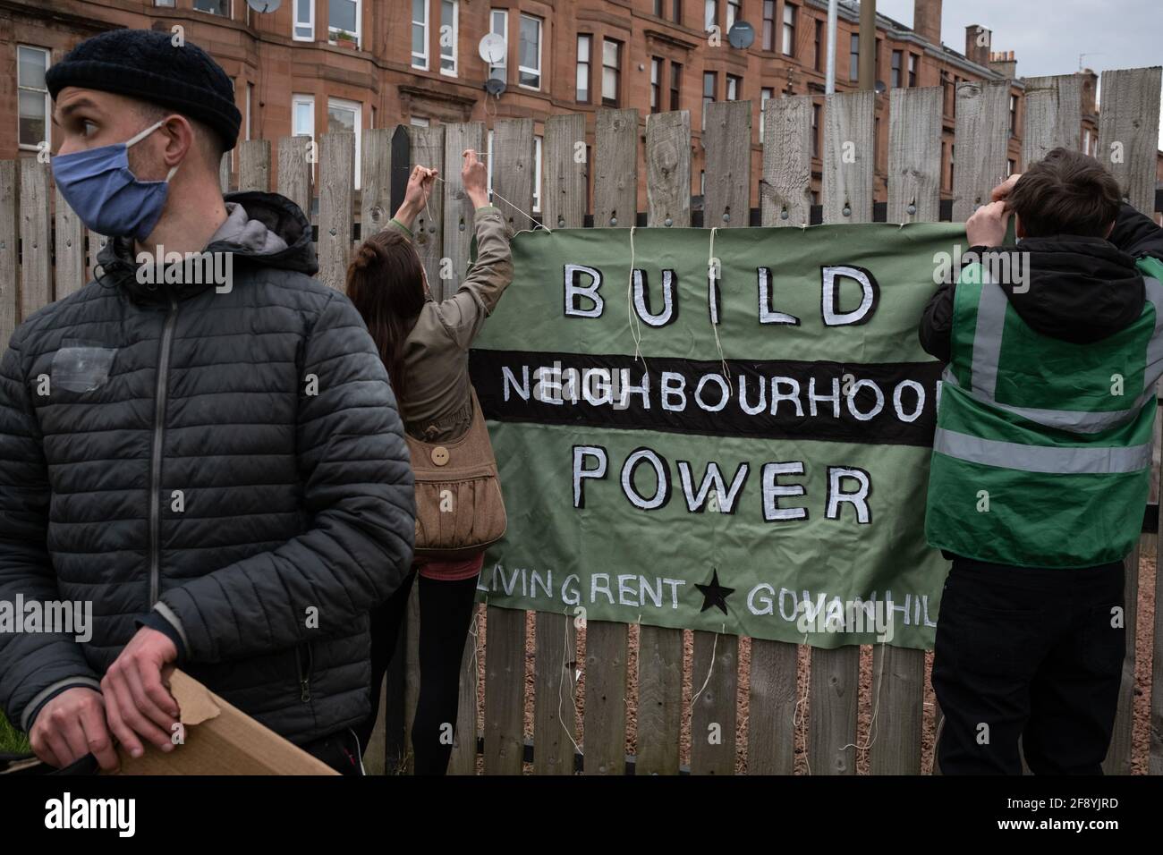 Glasgow, UK, 15th April 2021. Demonstration by Living Rent Glasgow as a  show of strength and supporter for a local resident (a mother with  children) in Govanhill district who is facing an