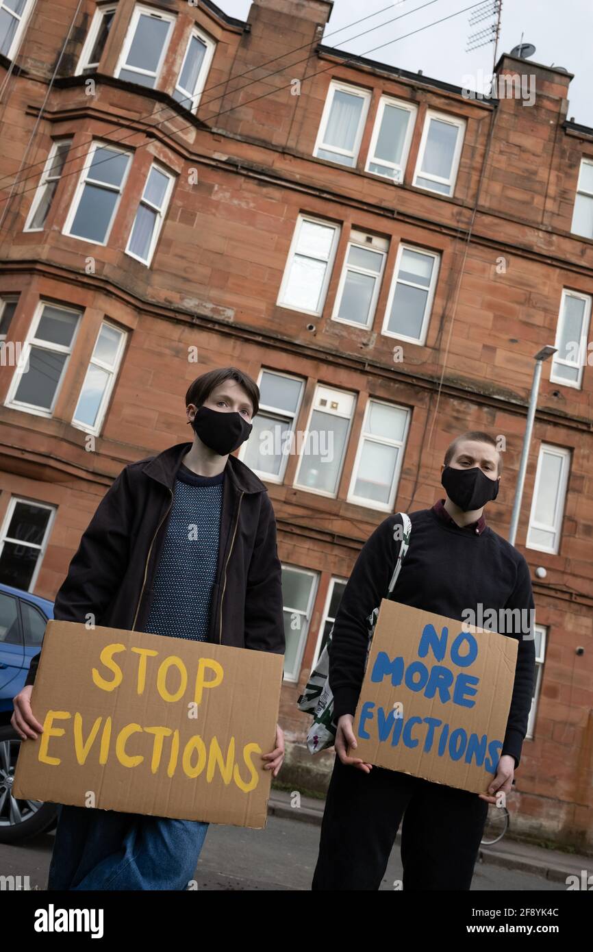 Glasgow, UK, 15th April 2021. Demonstration by Living Rent Glasgow as a  show of strength and supporter for a local resident (a mother with  children) in Govanhill district who is facing an