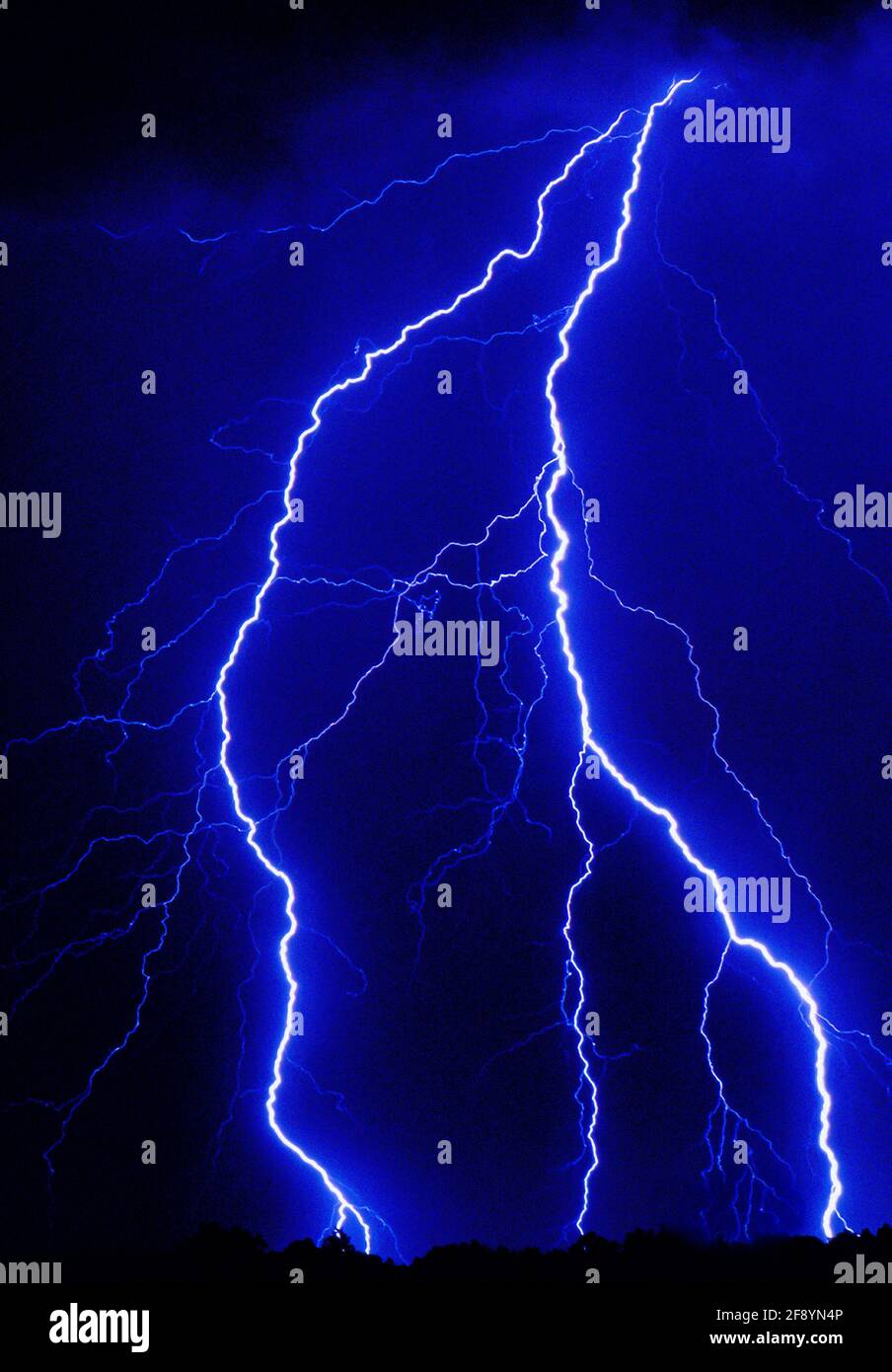 Bolt of lightning piercing night sky Stock Photo - Alamy