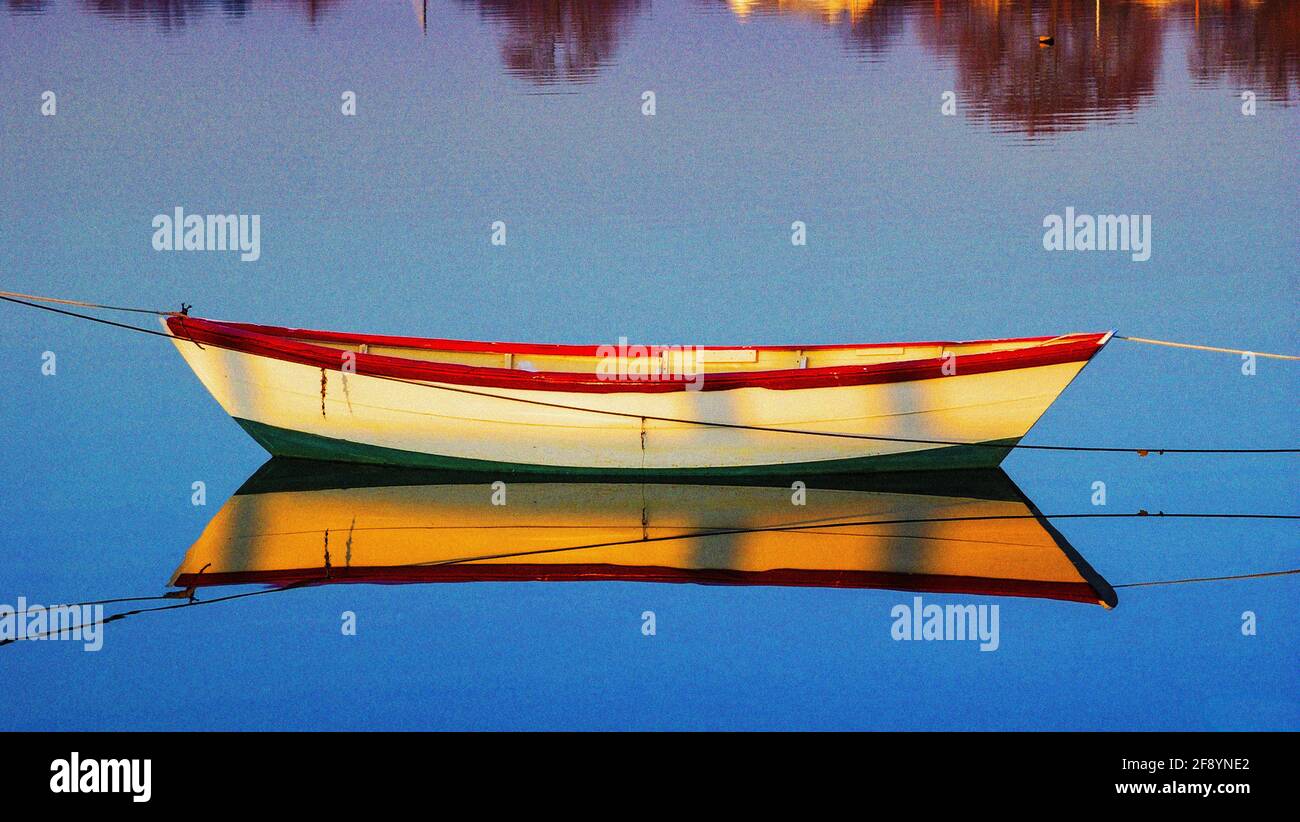 Canoe reflecting in water Stock Photo