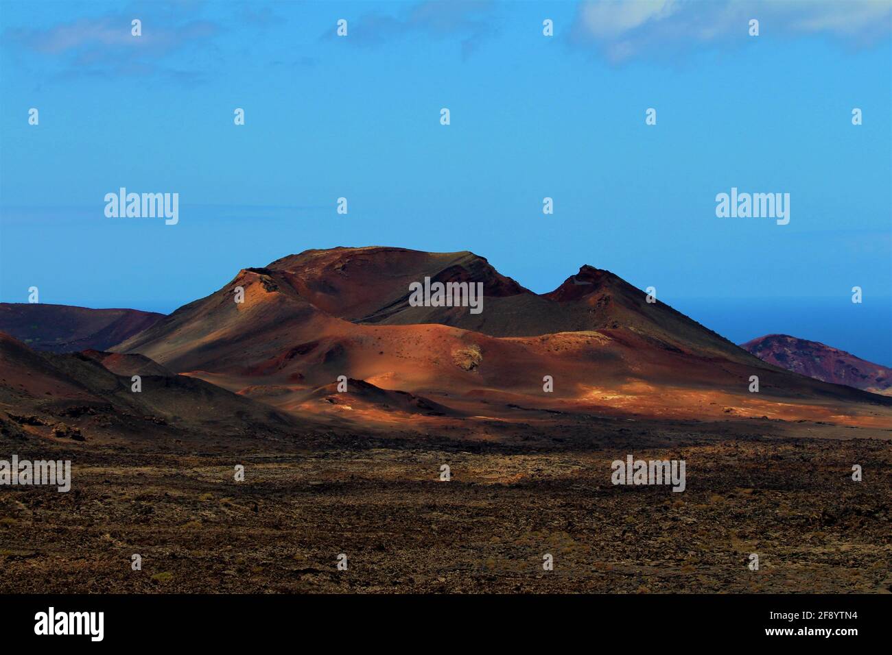 One of the volcanoes of Timanfaya National Park Stock Photo