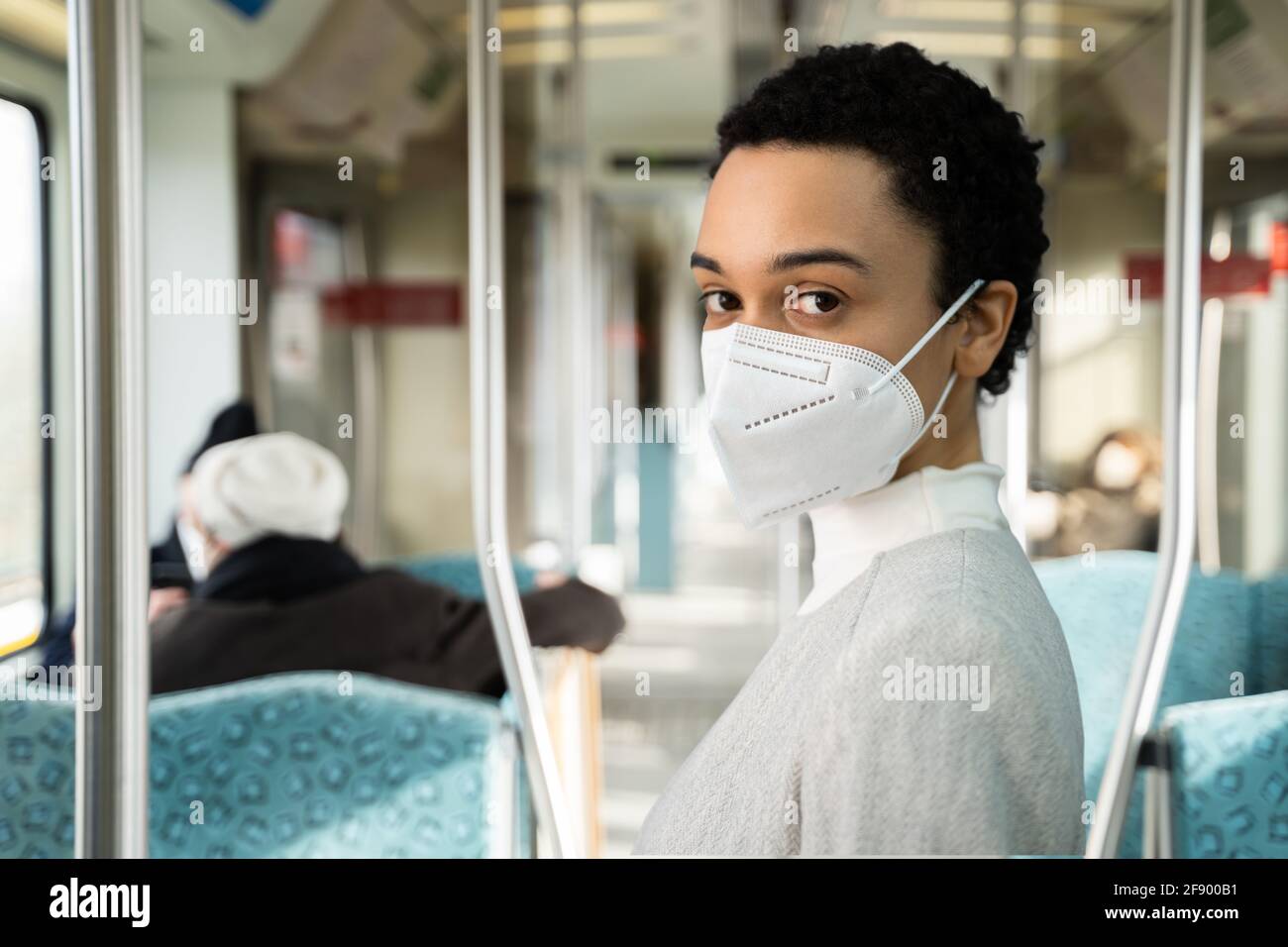 African American Woman Wearing Medical On Subway Train Stock Photo Alamy