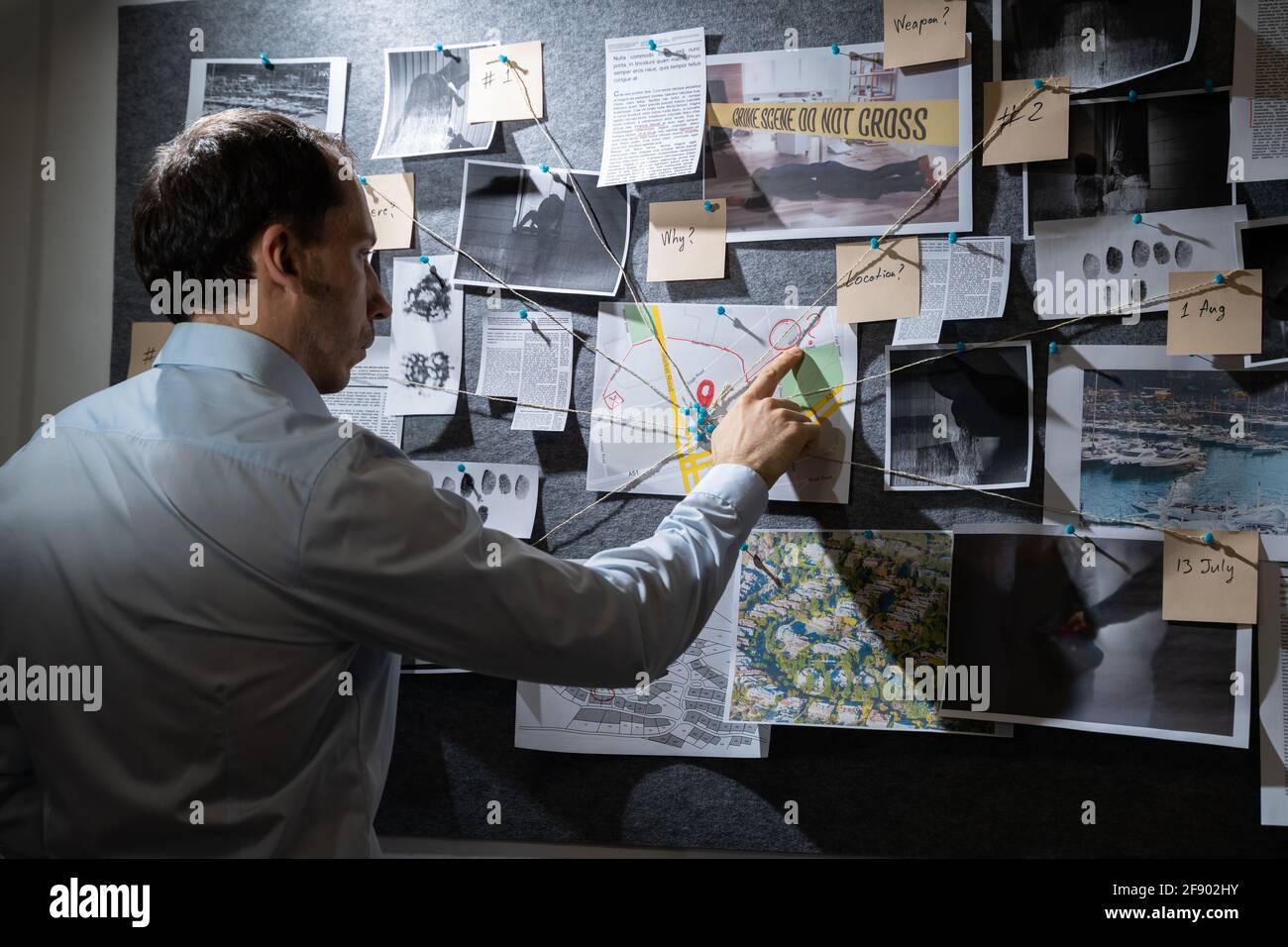 Policeman Or Private Detective Searching Crime Investigation Board