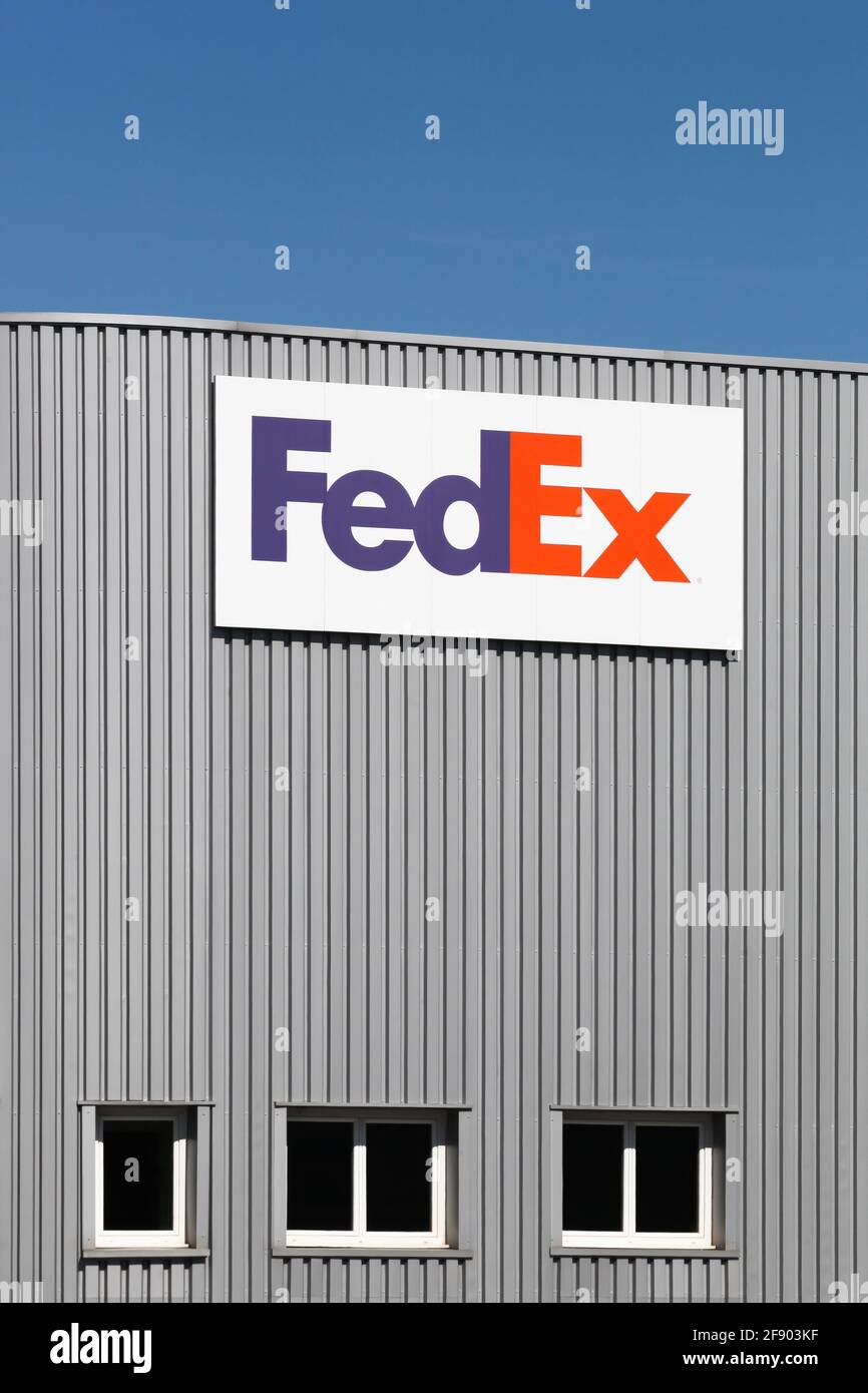 Voreppe, France - September 13, 2019: FedEx warehouse. FedEx Corporation is an American global courier delivery services company Stock Photo