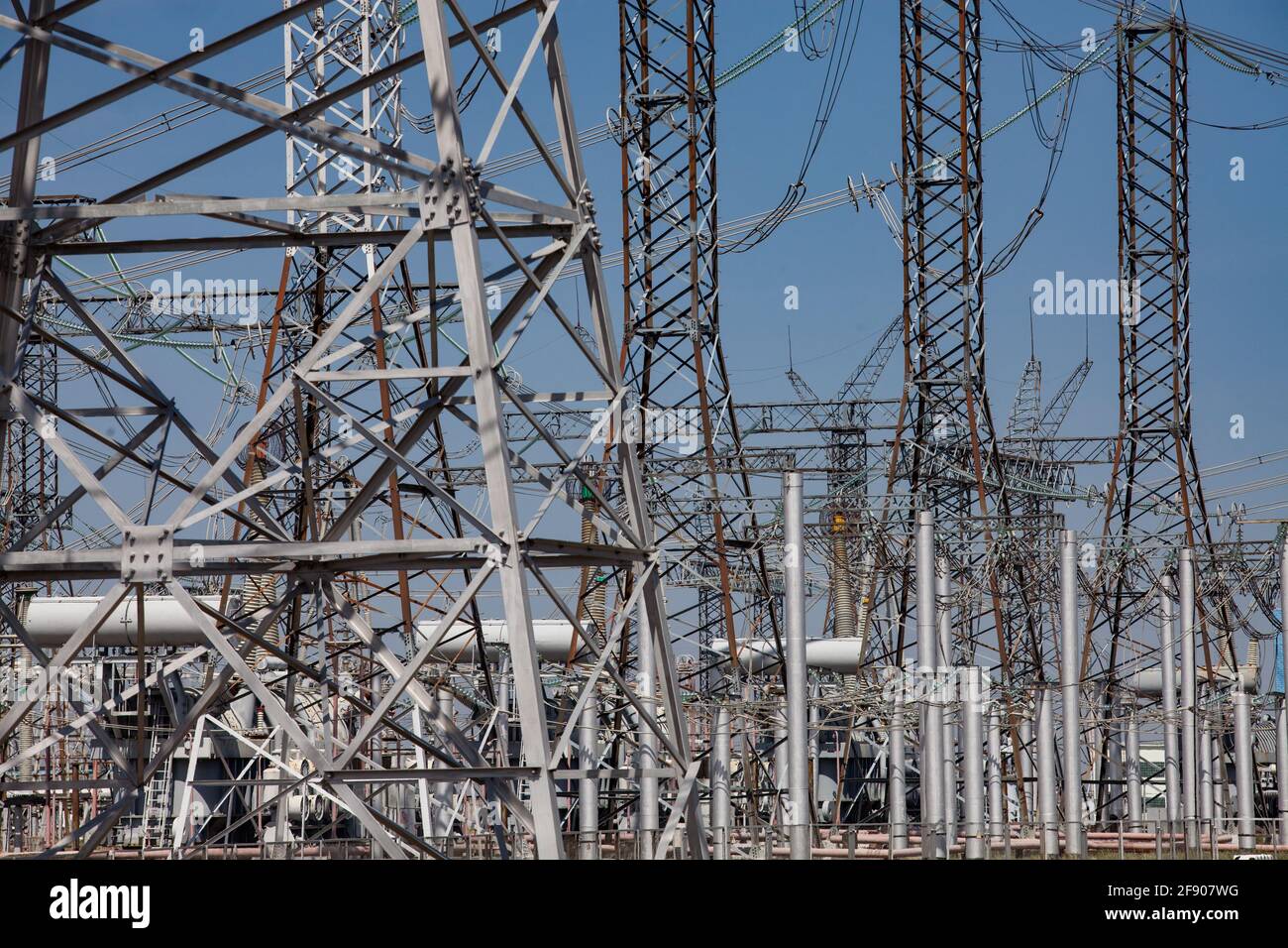Close-up of Electrical Distribution and transformer substation. Blue sky background. Stock Photo