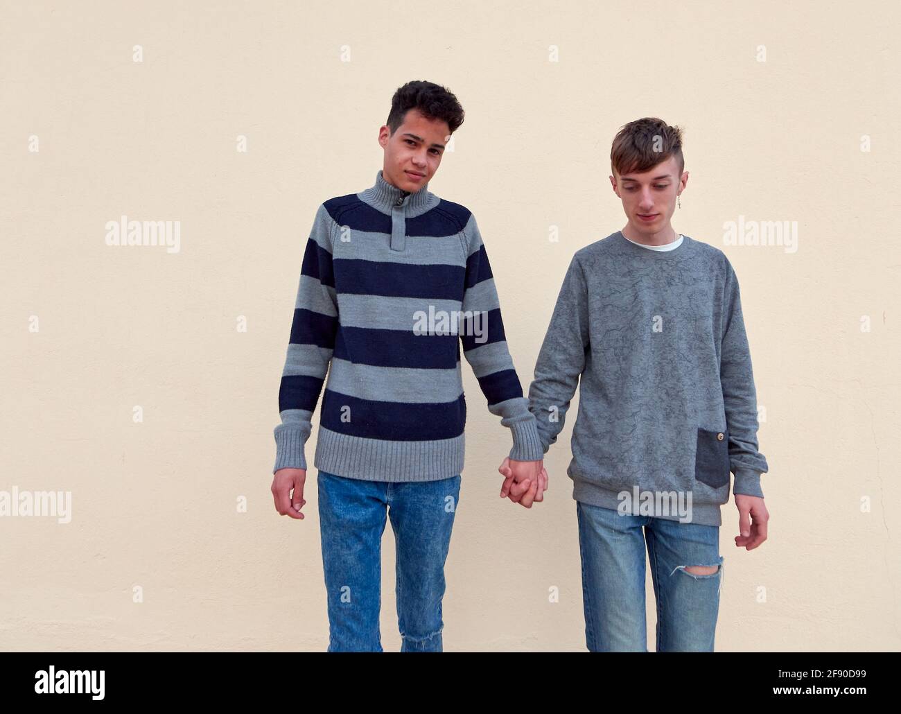 Interracial gay couple holding hands hi-res stock photography and images -  Alamy