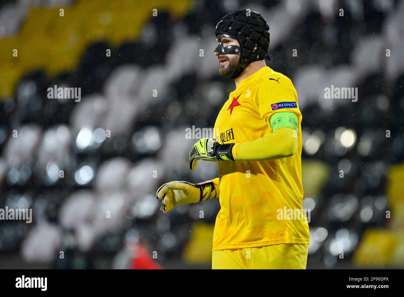 Prague, Czech Republic. 15th Apr, 2021. Goalie of Slavia Ondrej Kolar in action during the FC European Football League quarterfinal match SK Slavia Prague vs Arsenal in Prague, Czech Republic, April 15, 2021. Kolar played the Europa League quarterfinal game against Arsenal with a protective face mask. The UEFA disciplinary was banned Kemar Roofe of Rangers from four matches because he kicked in the face Slavia's goalkeeper Ondrej Kolar, March 18, 2021. Credit: Vit Simanek/CTK Photo/Alamy Live News Stock Photo