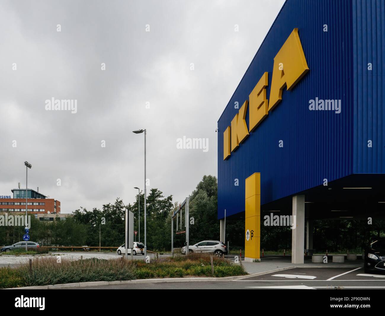 headquarter of IKEA Global with few cars in parking and Samsung