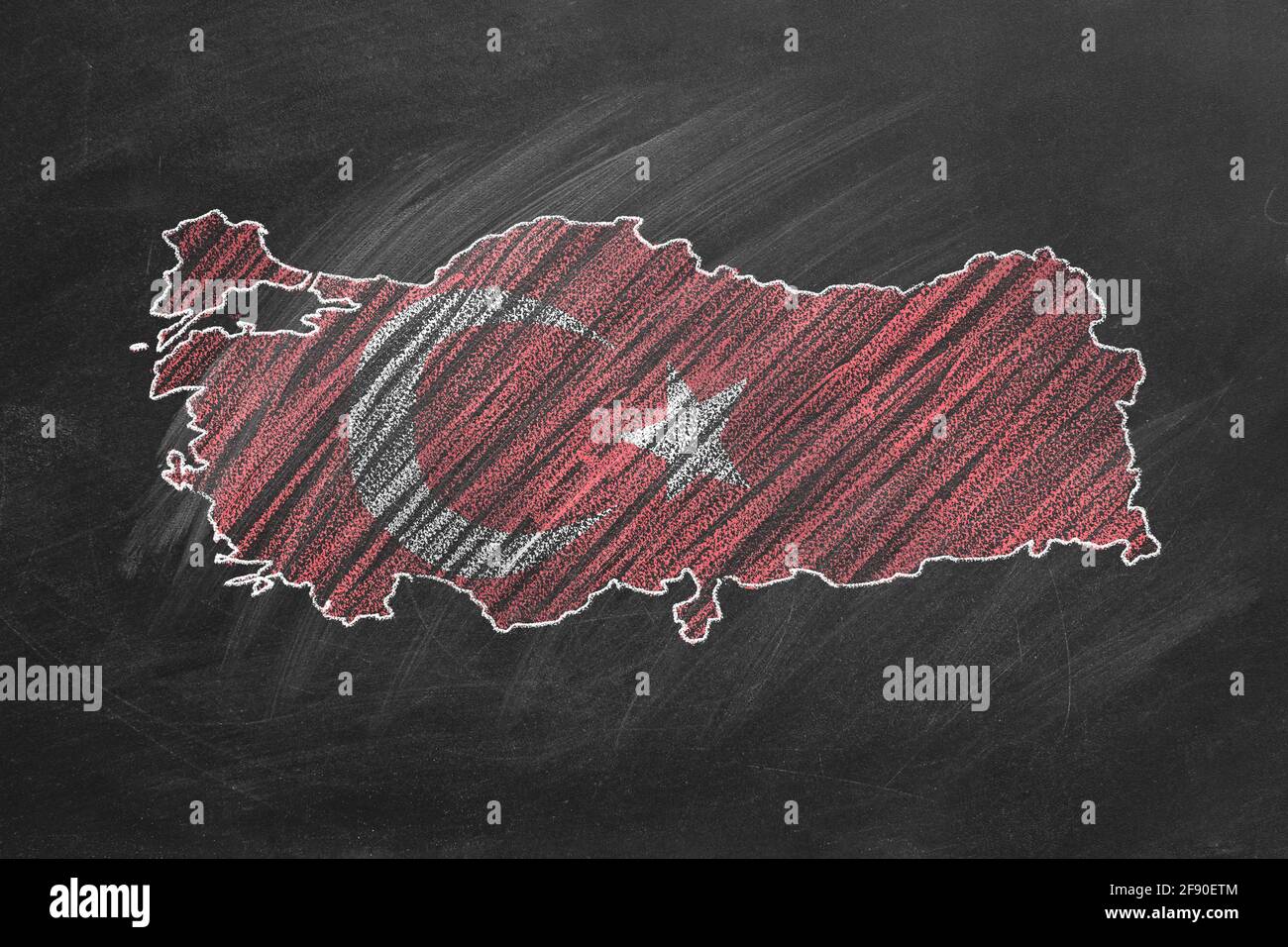 Country map and flag of Turkey drawing with chalk on a blackboard. One of a large series of maps and flags of different countries. Education, travel, Stock Photo