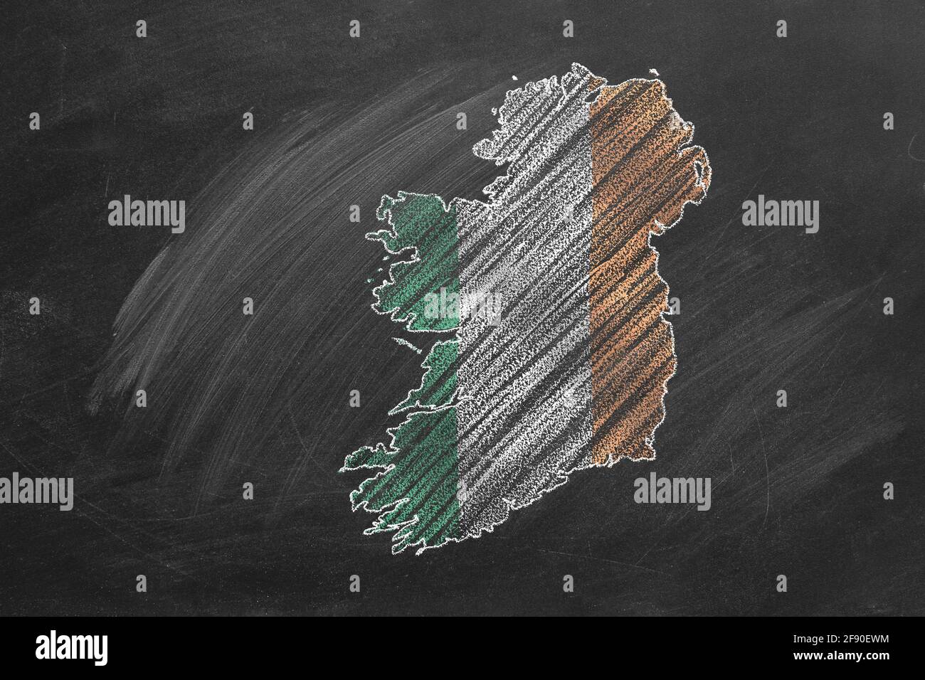 Country map and flag of Ireland drawing with chalk on a blackboard. One of a large series of maps and flags of different countries. Education, travel, Stock Photo