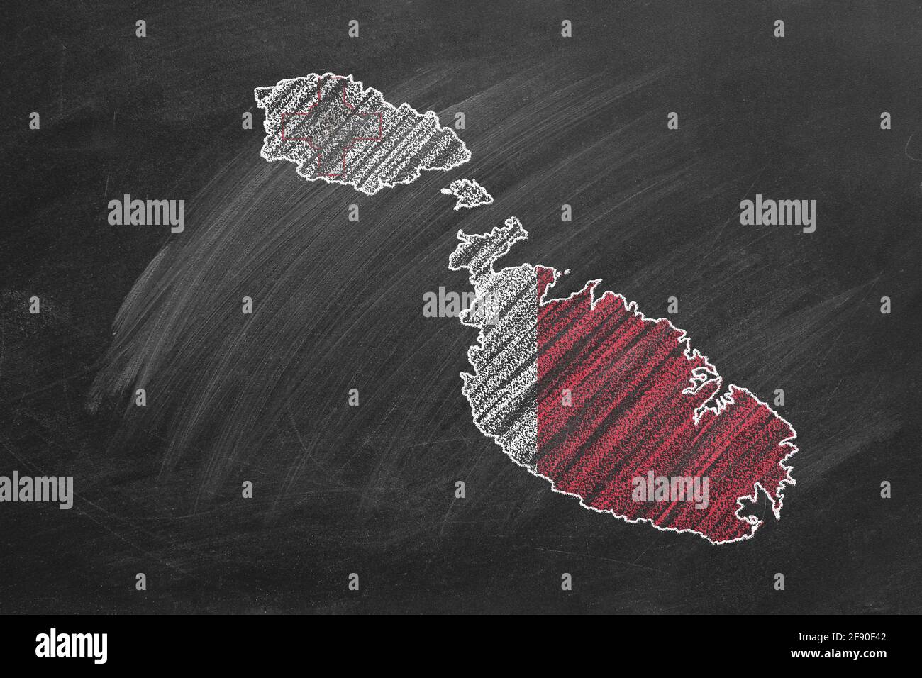 Country map and flag of Malta drawing with chalk on a blackboard. One of a large series of maps and flags of different countries. Education, travel, s Stock Photo