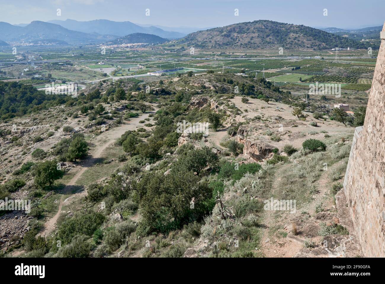 the castle is a defensive fortification with a length of almost a kilometer located at the top of the hill that protects the city of Sagunto, Spain Stock Photo