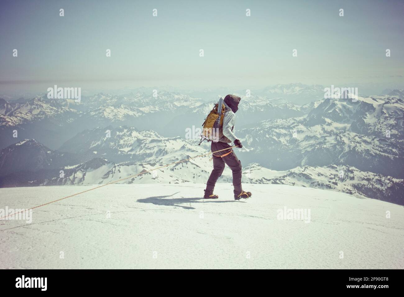 Mountaineer exploring summit of Mount Baker, Washington, USA. Stock Photo