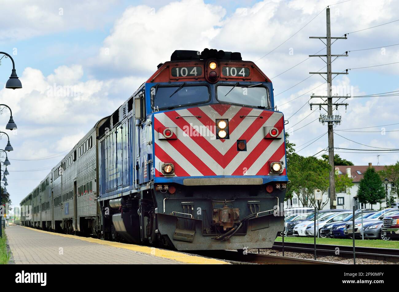 Bartlett, Illinois, USA. An outbound Metra commuter train arriving at the local commuter railroad station. Stock Photo