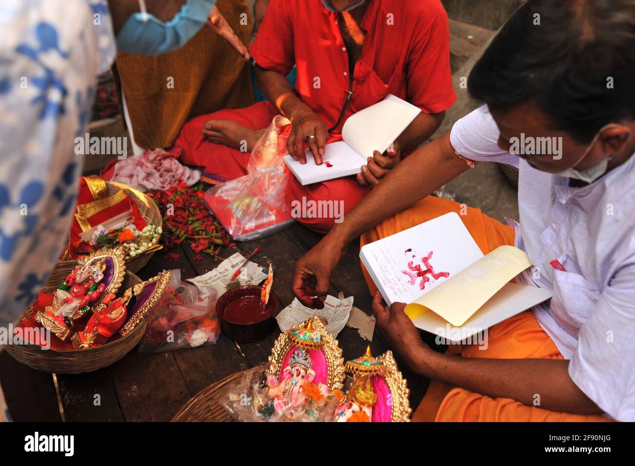 Kolkata, West Bengal, India. 15th Apr, 2021. People buying idols of to worship on Bengali New Year in Kolkata. Each year on April 15th, is the first day of Bengali New Year, celebrates globally by the Bengali speaking person. It was during the reign of Emperor Akbar during the Mughal rule in India, celebration of Bengali New Year began on this day. People worship Goddess Laxmi and God Ganesh, for wealth and prosperity with a morning ritual. This day is also beginning of the Bengali financial year when traders and businessman they do performs ritual of their books of accounts. It's an auspici Stock Photo
