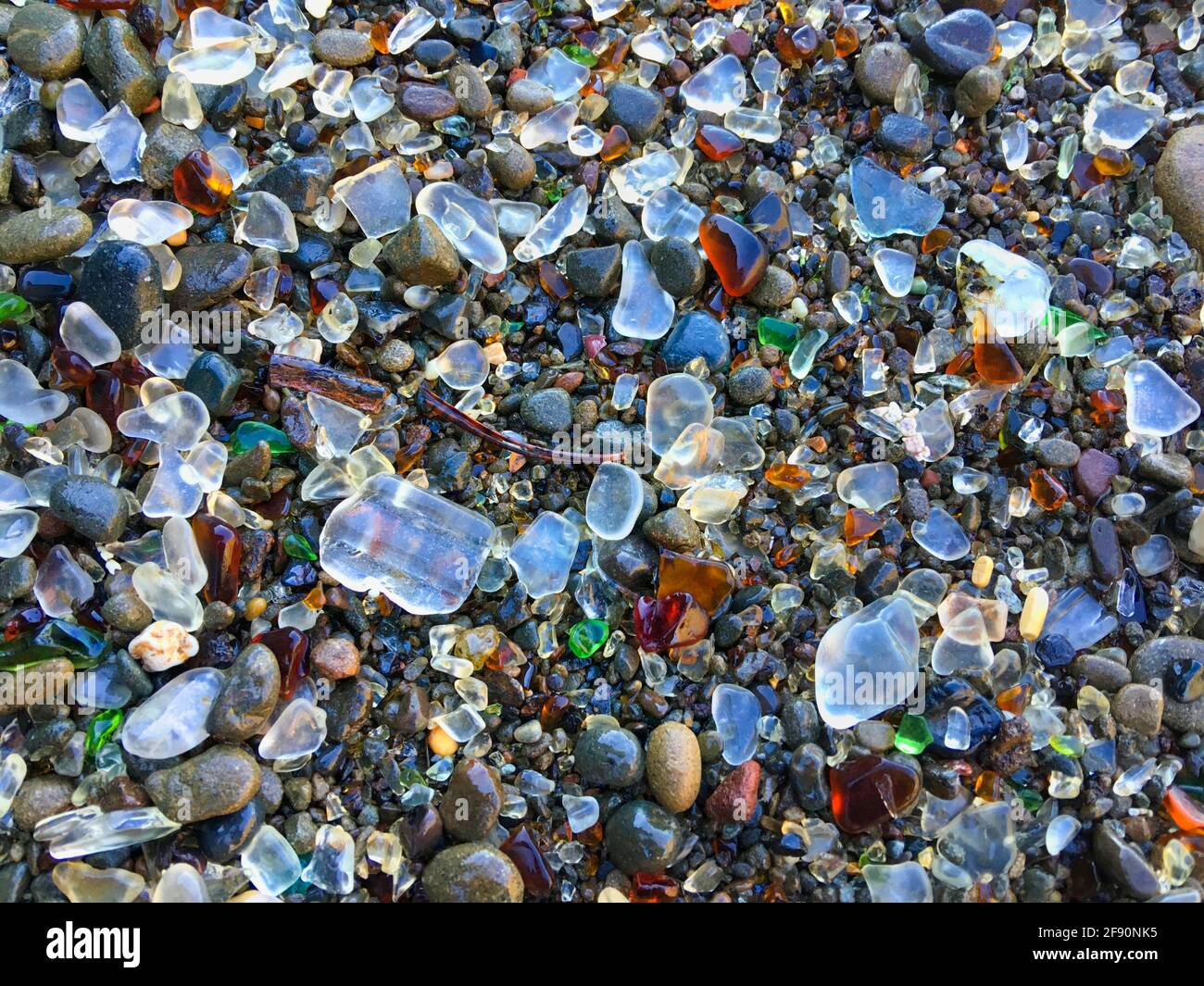 Close up shot of crystal stones on beach Stock Photo