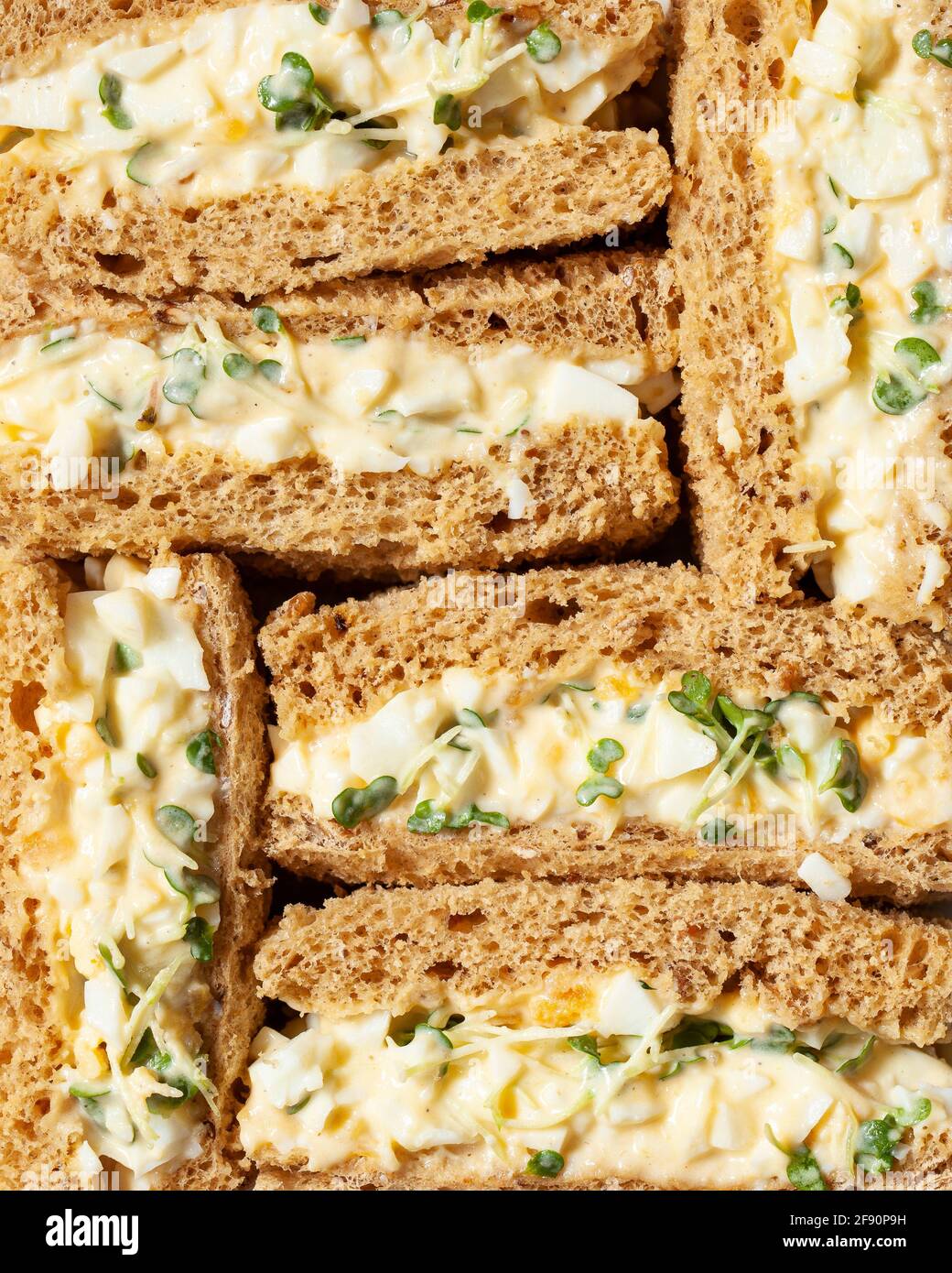 Close up of egg mayonnaise sandwiches made on brown bread Stock Photo