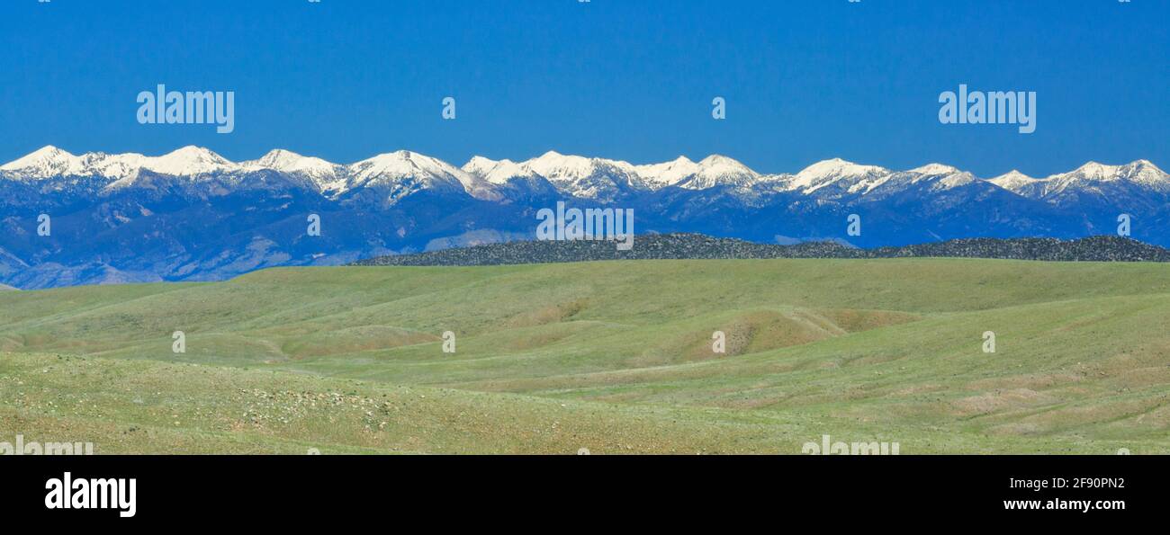 rangeland and peaks of the tobacco root mountains near dillon, montana Stock Photo